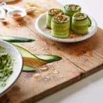 Raw Vegan Cucumber Avocado Sushi Rolls garnished with paprika
