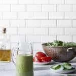 Vegan Green Goddess Dressing in a glass jug