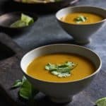 Vegan Thai Pumpkin Soup in a bowl with cilantro