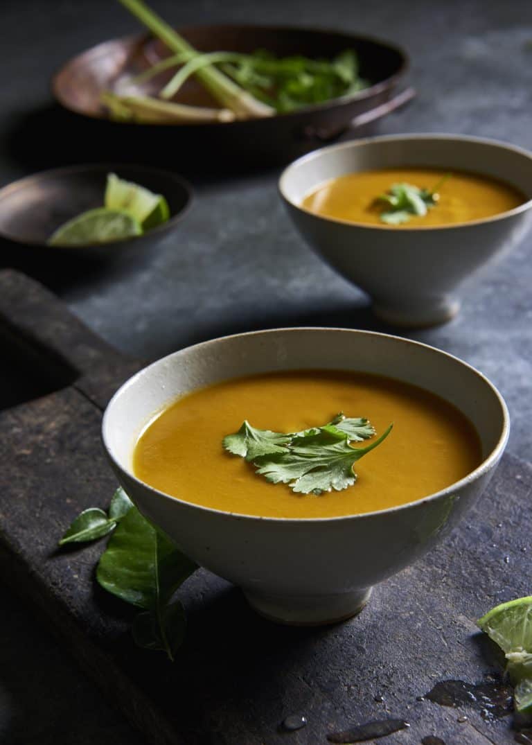 Vegan Thai Pumpkin Soup in a bowl with cilantro