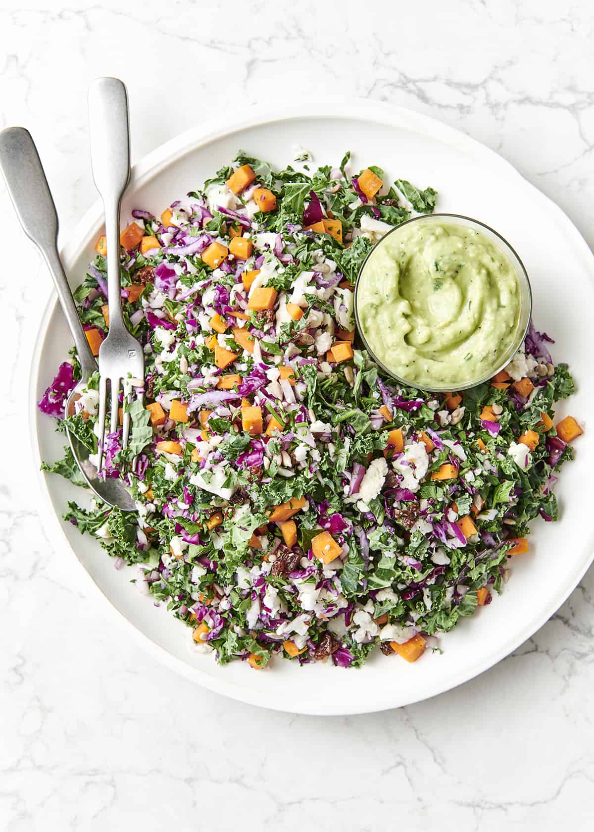 https://www.theblendergirl.com/wp-content/uploads/2019/03/Vegan-Chopped-Salad-with-Avocado-Dressing.jpg